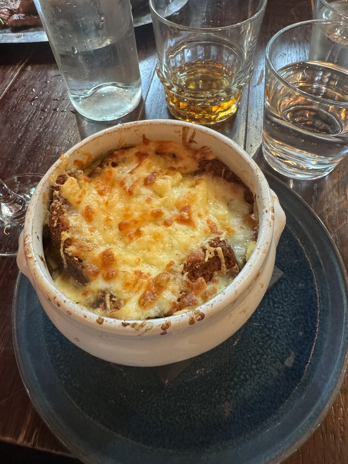 A bubbling crock of French onion soup gratinée.